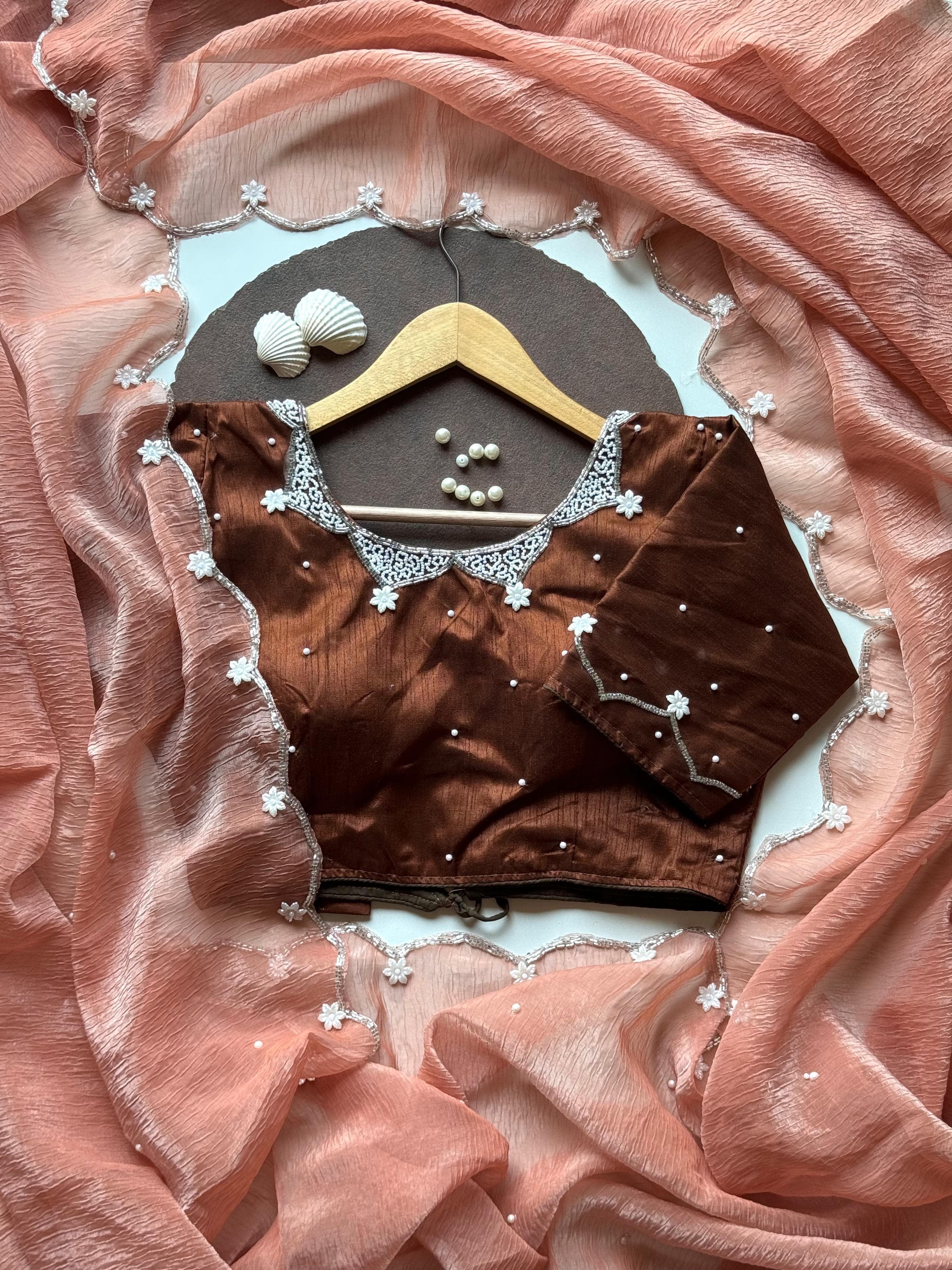 Pearls on Rust Saree