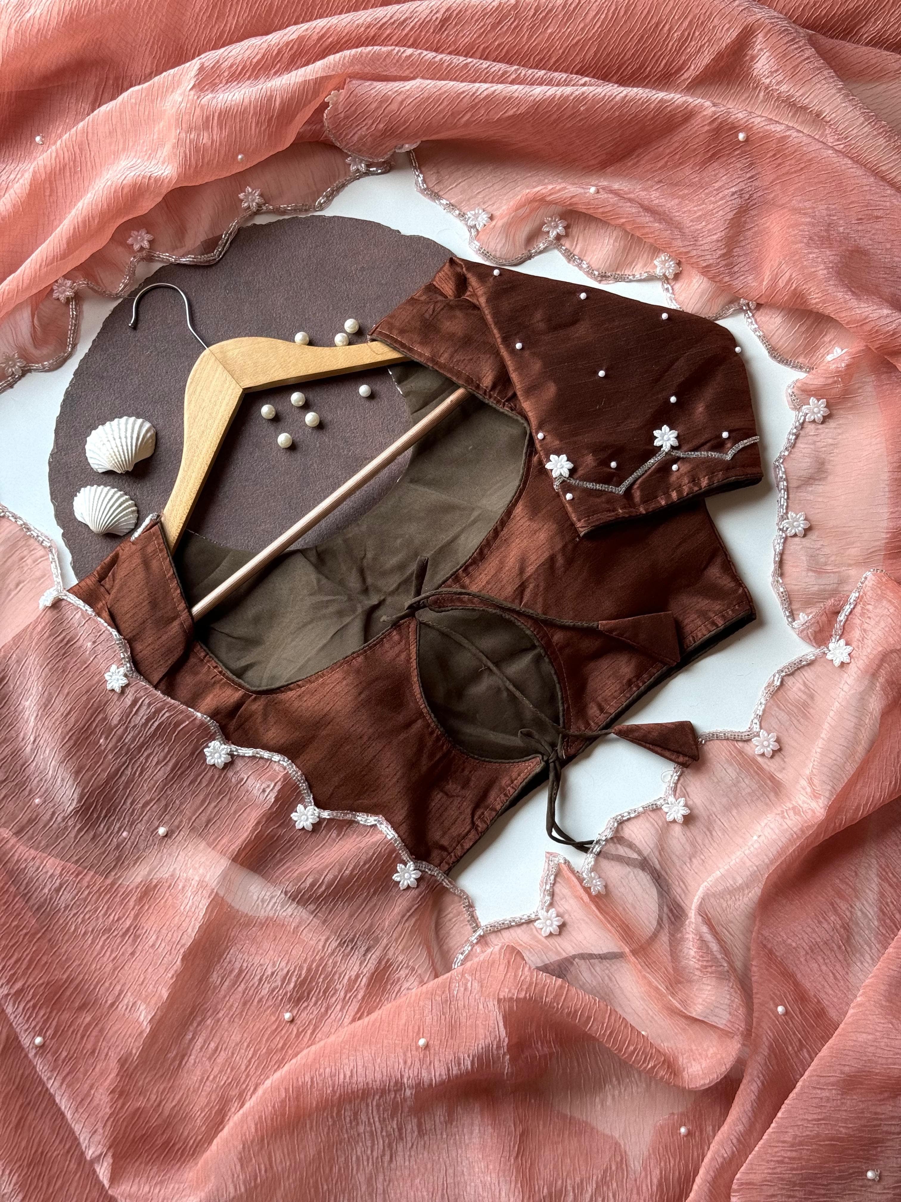 Pearls on Rust Saree